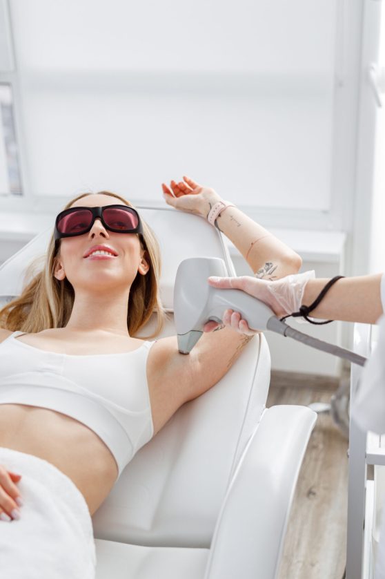 smiling-woman-receiving-laser-epilation-treatment-2022-03-31-23-47-35-utc